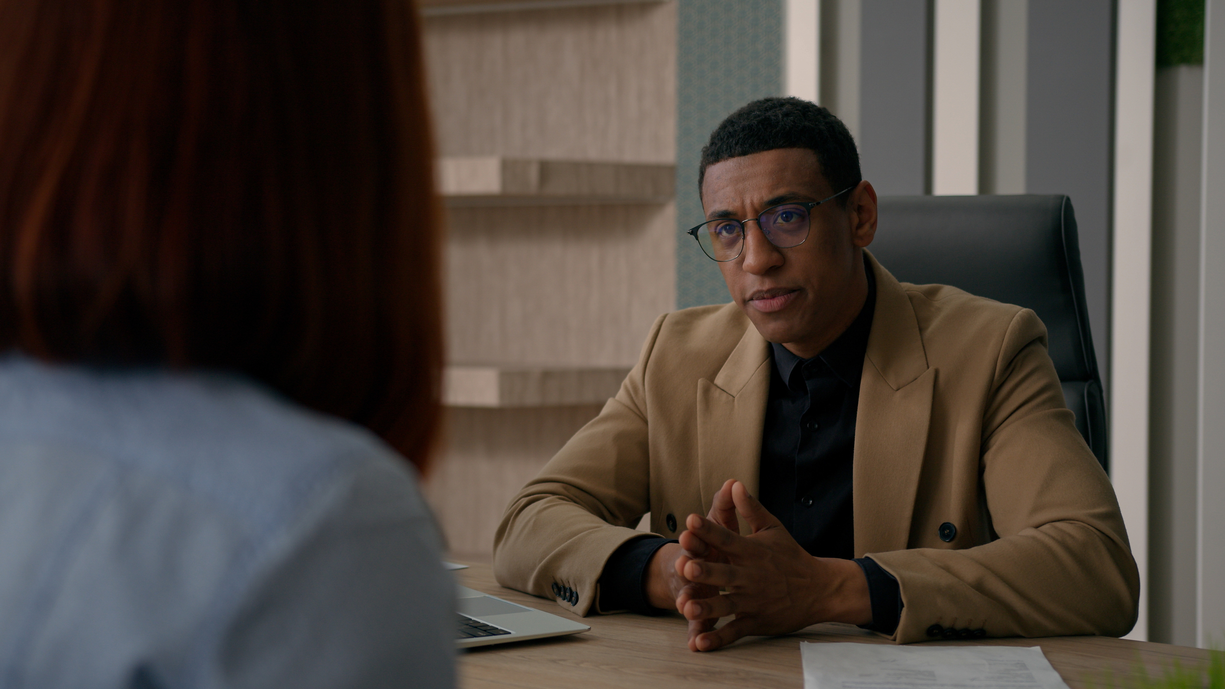 An workers' rights lawyer listens to his client's concerns about her mandatory arbitration agreement as she navigates her worngful termination claim.