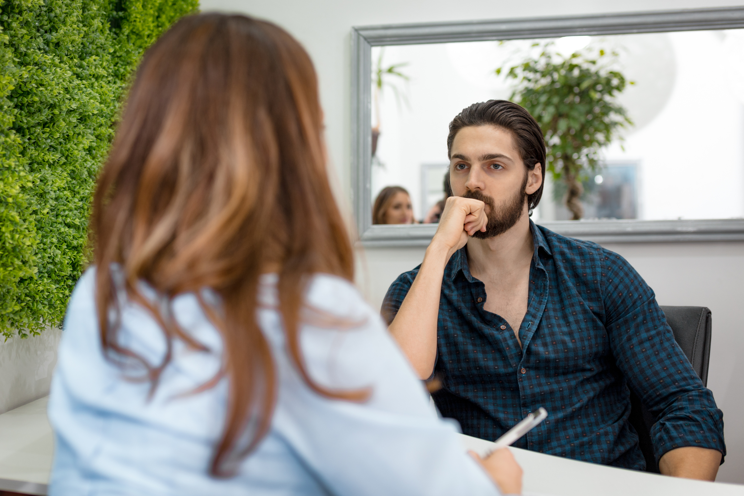 A New York employer holds an interview with a potential candidate.